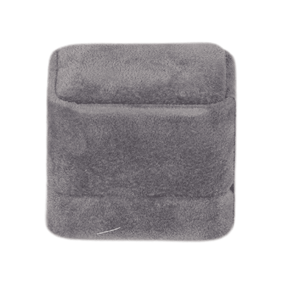 Dark grey velvet ring box with a cushion interior, displaying an engagement ring side1