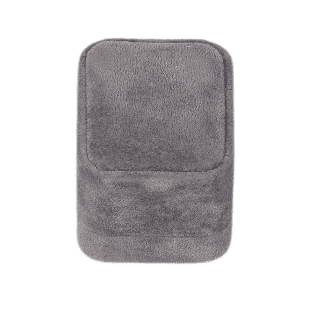 Dark grey velvet ring box with a cushion interior, displaying an engagement ring close 2