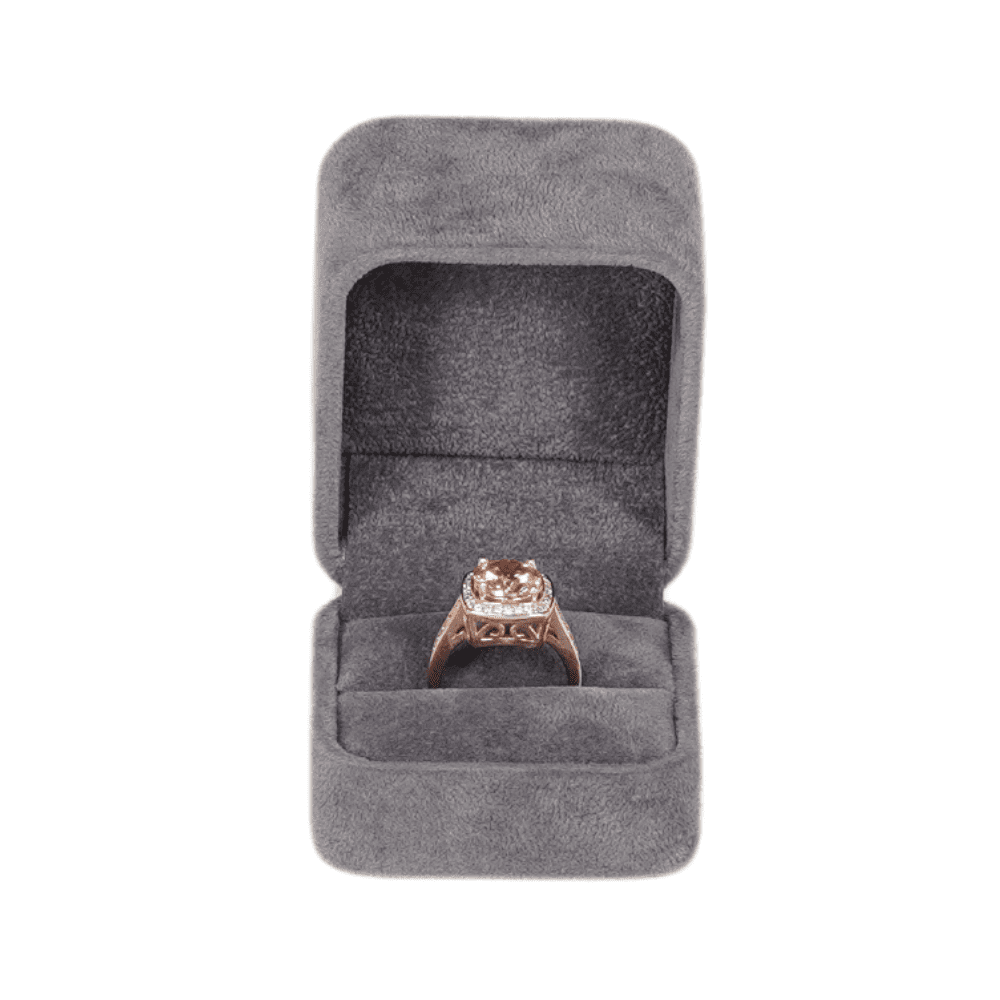 Dark grey velvet ring box with a cushion interior, displaying an engagement ring top