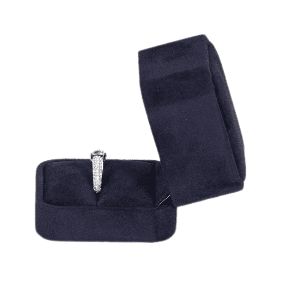 Royal blue velvet ring box with a cushion interior, displaying an engagement ring -side