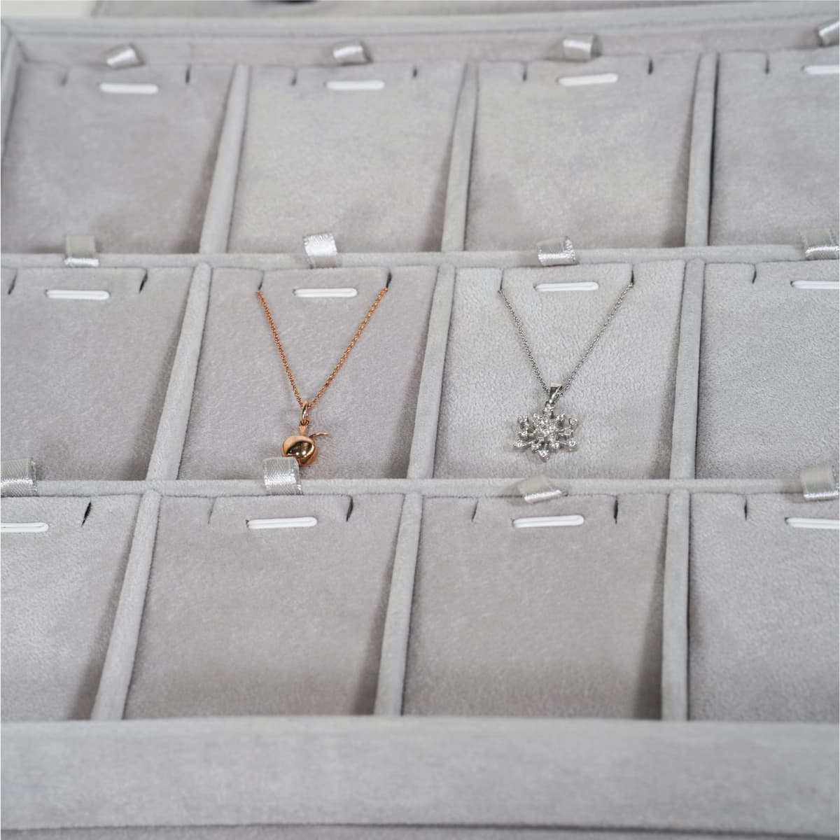 Multi-Compartment Jewellery Tray for Necklaces and Pendants-grey-TRP81-3 Detailed view of necklace placement in a grey velvet multi-compartment jewellery tray.