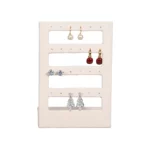 stud earring stand small beige front view with earring