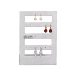 stud earring stand small grey front view with earring
